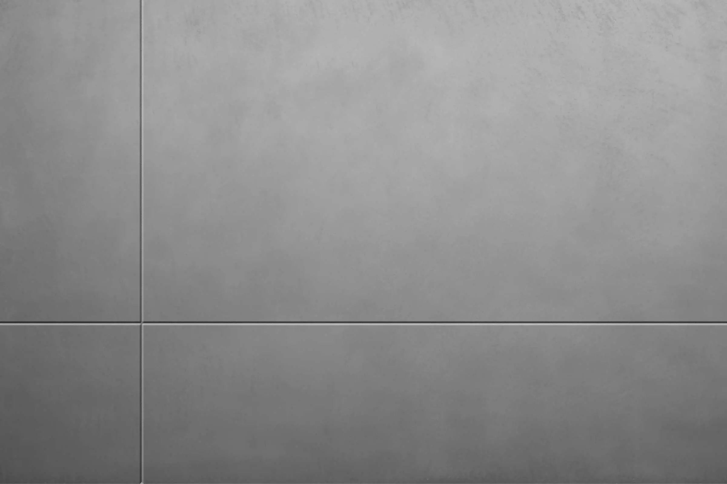 Vanjska žbuka u betonskoj optici StoSignature, siva žbukana površina s karakterom izloženog betona